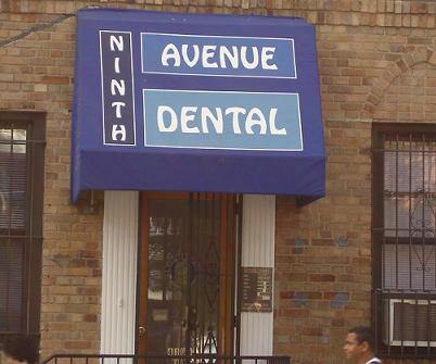 The image shows a storefront with a blue sign that reads  Avenue Dental  above a blue awning.